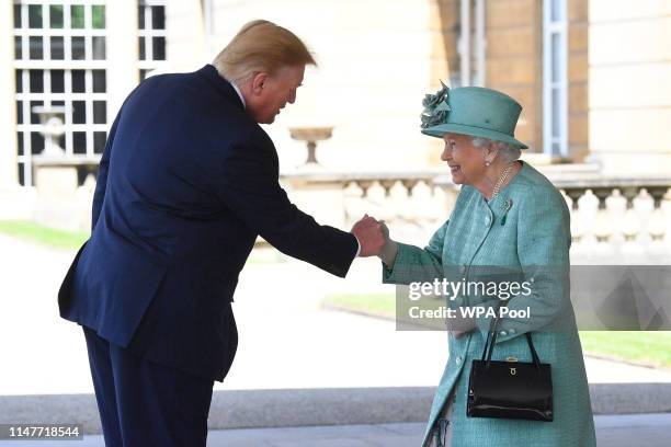 President Donald Trump is greeted by Queen Elizabeth II at Buckingham Palace on June 3, 2019 in London, England. President Trump's three-day state...