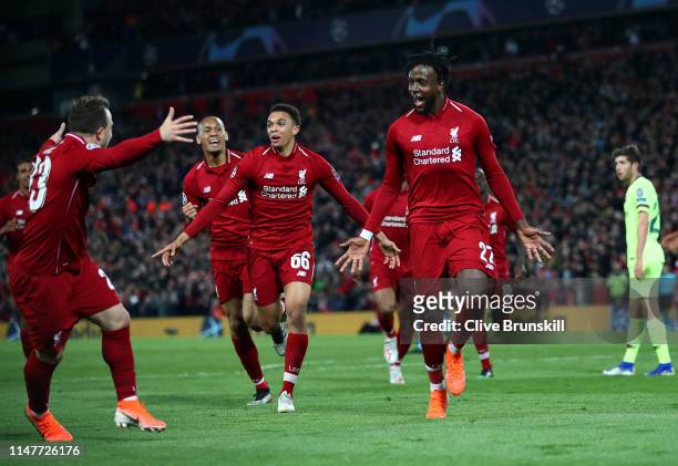 Divock Origi of Liverpool celebrates as he scores his team's fourth goal with Xherdan Shaqiri and team mates during the UEFA Champions League Semi...