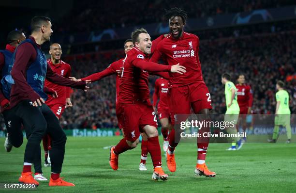 Divock Origi of Liverpool celebrates as he scores his team's fourth goal with Xherdan Shaqiri and team mates during the UEFA Champions League Semi...