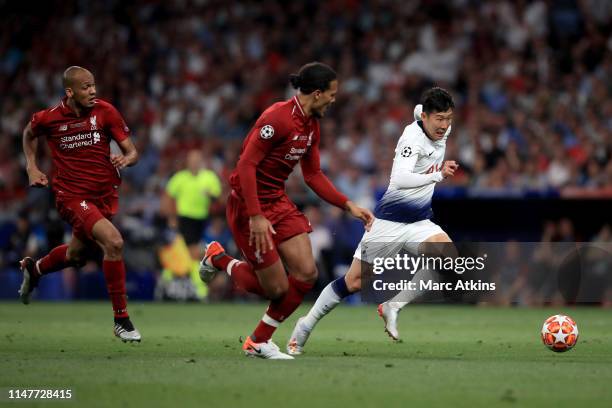 Son Heung-min of Tottenham Hotspur in action with Virgil van Dijk and Fabinho of Liverpool during the UEFA Champions League Final between Tottenham...