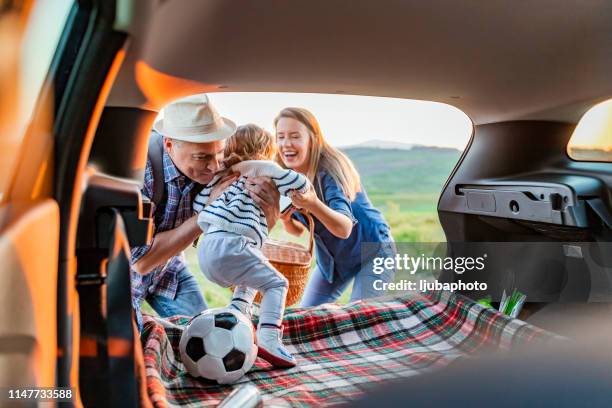 more than play, it's a time to bond - three people in car stock pictures, royalty-free photos & images