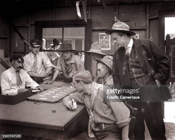 1890s 1900s 1910s FARO CARD GAME MEN PLAYING GAMBLING IN OLD WILD WEST SALOON silent movie still uncorrected glass plate