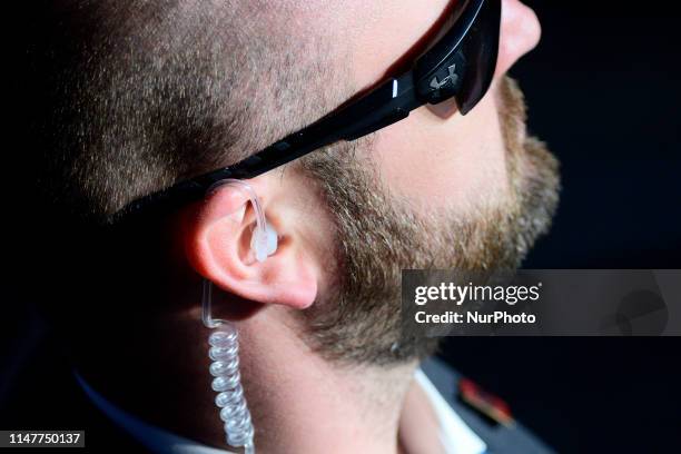 Secret Service agent stands guard while US President Donald J. Trump depart after speaking at a MAGA rally at the Williamsport Regional Airport, in...