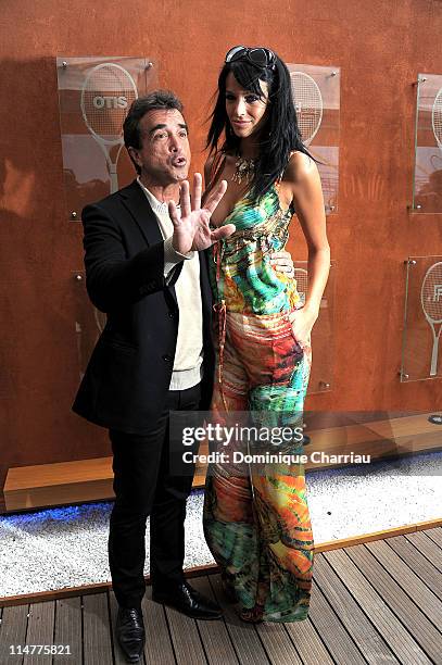 Arnaud Lagardere and Jade Foret pose as they arrive at the French open at Roland Garros on May 26, 2011 in Paris, France.