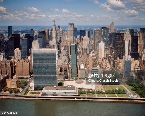 1970s 1979 AERIAL VIEW MIDTOWN MANHATTAN SKYLINE FROM EAST RIVER LOOKING WEST UNITED NATIONS AND CHRYSLER BUILDINGS