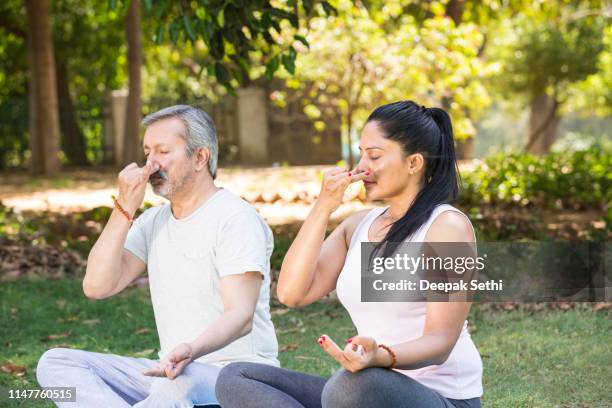 fitness coaching - stock images - senior inhaling stock pictures, royalty-free photos & images