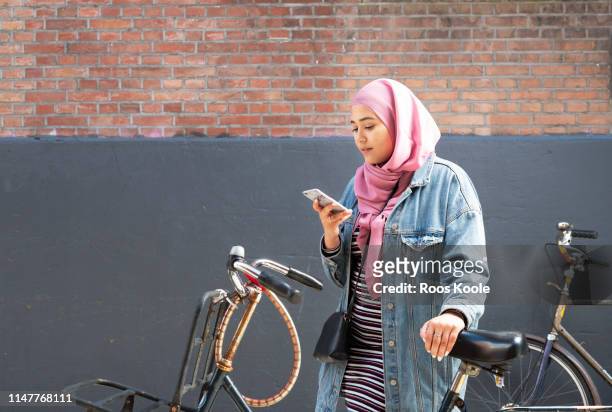 Teenage girl with bicyle