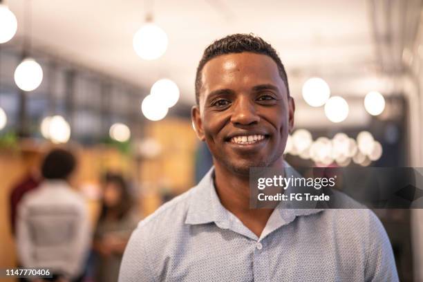 african businessman portrait at modern startup company - pardo brazilian stock pictures, royalty-free photos & images