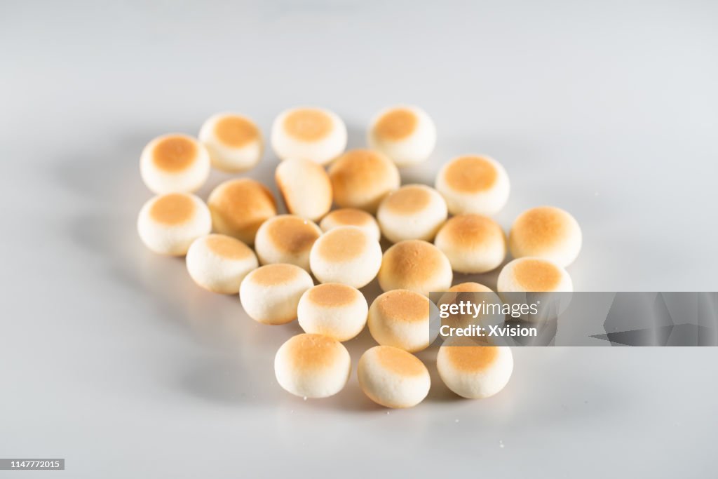 Small bread cookie jump in mid air with white background
