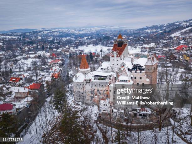 bran castle covered in snow in winter, transylvania, romania, europe - bran castle stock pictures, royalty-free photos & images