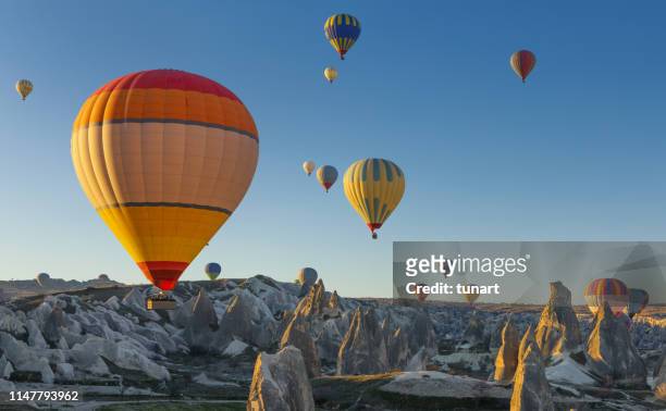 hot air balloons in cappadocia, turkey - cappadocia hot air balloon stock pictures, royalty-free photos & images