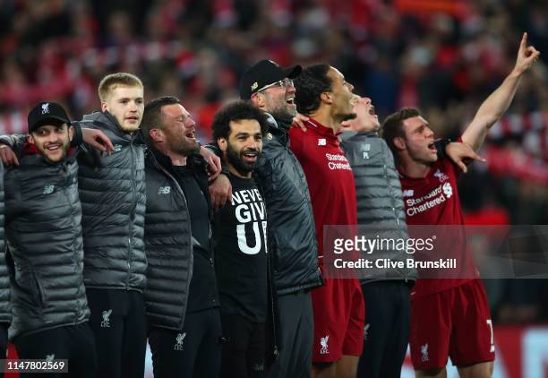 Mohamed Salah of Liverpool celebrates with his team mates wearing a shirt with the words Never Give Up after the UEFA Champions League Semi Final...
