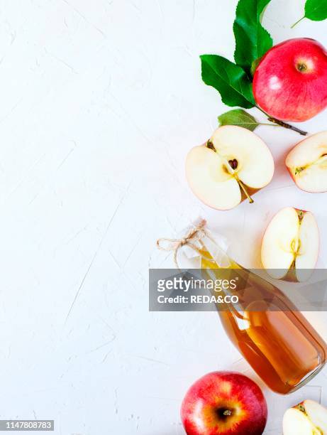Apple cider vinegar and fresh apples, copy space.