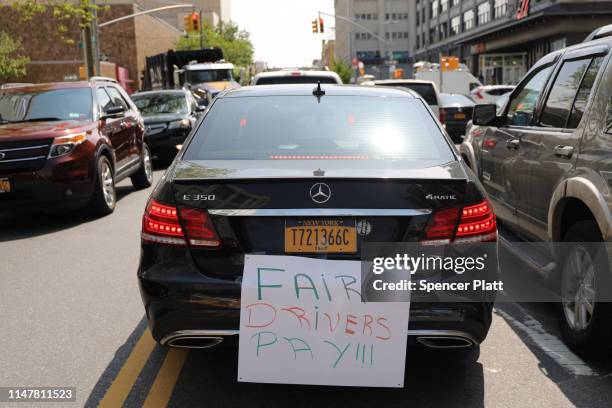 Uber and other app-based drivers participate in a rally outside of the New York City and Uber and Lyft headquarters on May 08, 2019 in New York City....