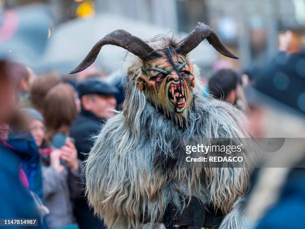 Krampuslauf or Perchtenlauf during advent in Munich. An old alpine tradition taking place during christmas time in Bavaria. Austria and South Tyrol....