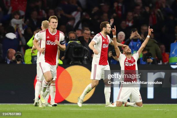 Hakim Ziyech of Ajax celebrates after scoring his team's second goal with Daley Blind of Ajax during the UEFA Champions League Semi Final second leg...