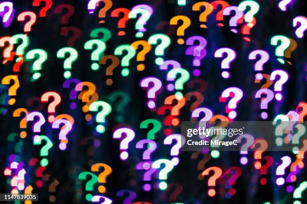 question mark shape bokeh backdrop - fragezeichen stock-fotos und bilder
