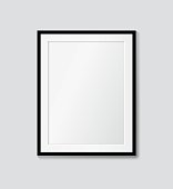 Black frame with passepartout on the wall. Vector picture frame mock up