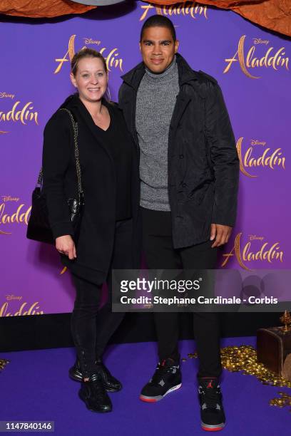Daniel Narcisse and a guest attend the “Aladdin” Paris Gala Screening at Cinema Le Grand Rex on May 08, 2019 in Paris, France.