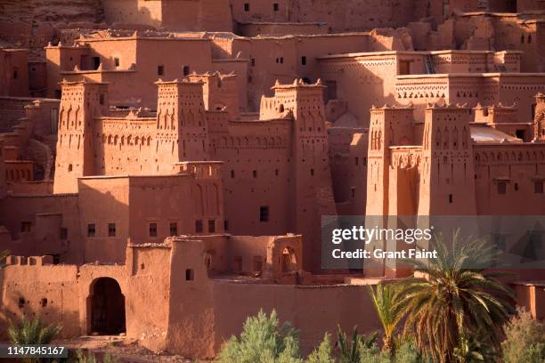 ancient village set in hill. - morocco stock pictures, royalty-free photos & images