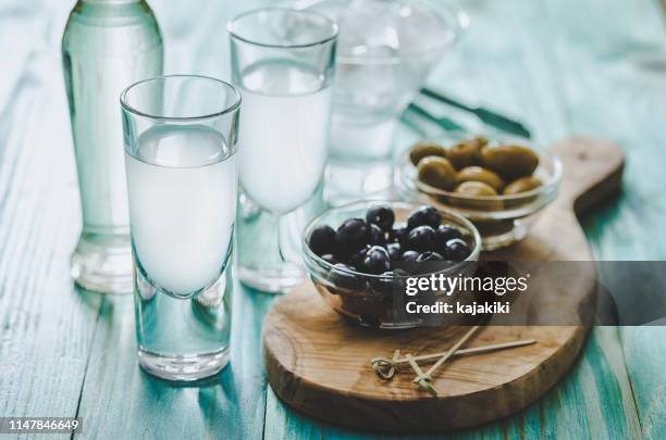 greek ouzo and olives - ouzo stock pictures, royalty-free photos & images