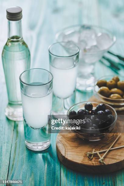 greek ouzo and olives - ouzo stock pictures, royalty-free photos & images