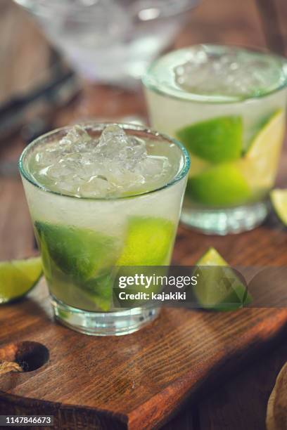 sweet and refreshing drink caipirinha cocktail - caipirinha stock pictures, royalty-free photos & images