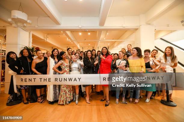 Chief Operating Officer Maureen Sullivan and San Francisco Mayor London Breed cut the ceremonial ribbon with Rent the Runway staff and guests during...