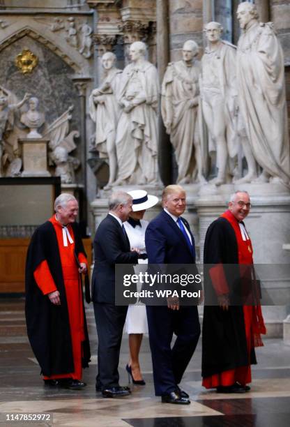 President Donald Trump and First Lady Melania Trump are accompanied by Prince Andrew, Duke of York and the Dean of Westminster, John Hall during a...