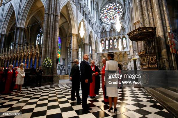 President Donald Trump and First Lady Melania Trump are accompanied by Prince Andrew, Duke of York and the Dean of Westminster, John Hall during a...