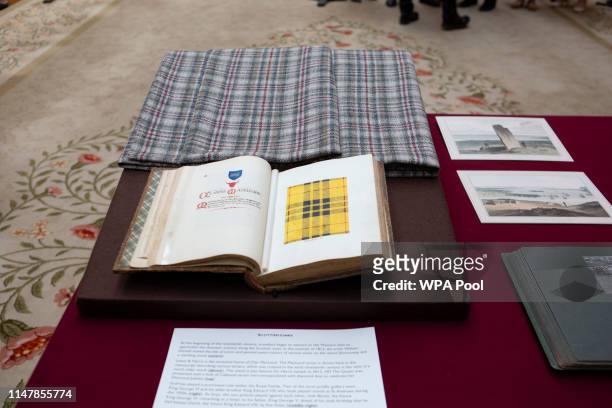 The Clan MacLeod tartan, in reference to the President's mother Mary Anne MacLeod, is seen in a book as Queen Elizabeth II, US President Donald Trump...