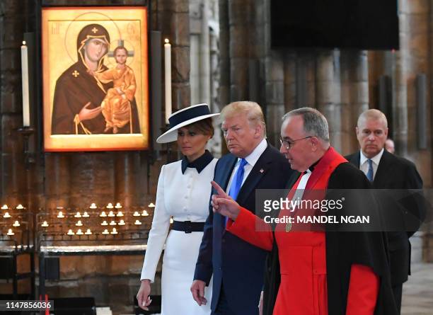Dean of Westminster Abbey John Hall directs US President Donald Trump and US First Lady Melania Trump as Britain's Prince Andrew, Duke of York,...