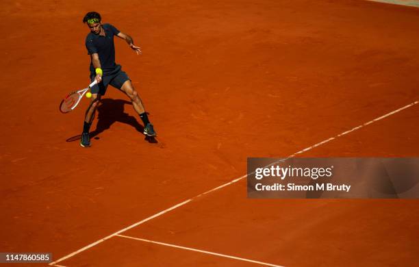 Roger Federer from Switzerland in action against Novak Djokovic of Serbia during the French Open Men's Singles Semi Final at Roland Garros on June...