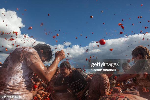 Attendants throw tomatoes at each other during the annual "The Great Tomatina Colombiana in Sutamarchan, Colombia on June 02, 2019. The Great...