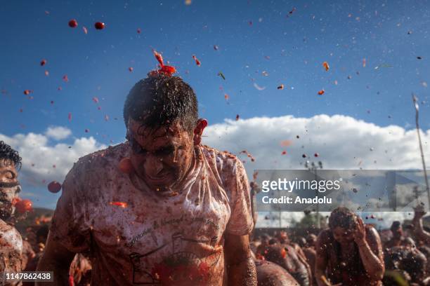 Attendants throw tomatoes at each other during the annual "The Great Tomatina Colombiana in Sutamarchan, Colombia on June 02, 2019. The Great...
