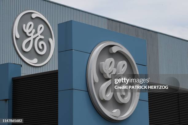 The logo of US giant General Electric is pictured as French Economy and Finance Minister Bruno Le Maire takes part to a meeting with managers and...