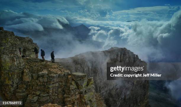 climbers on the side of chief mountain, glacier national park, montana, usa. - blackfoot stock pictures, royalty-free photos & images