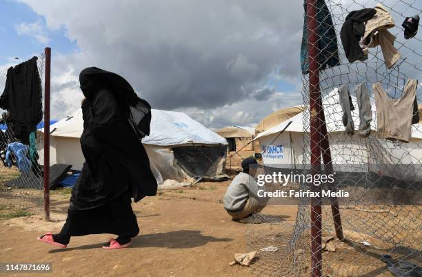 Foreign wives and children of former ISIS fighters go about their day in the foreign section of the al-Hawl refugee camp in northern Syria, close to...