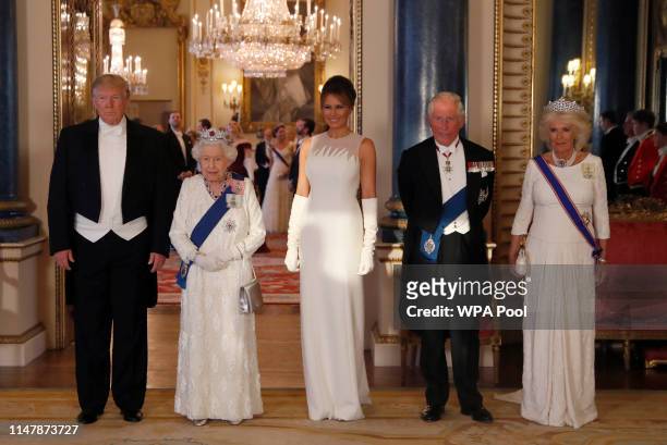 President Donald Trump, Queen Elizabeth II, First Lady Melania Trump, Prince Charles Prince of Wales and Camilla Duchess of Cornwall pose for a...