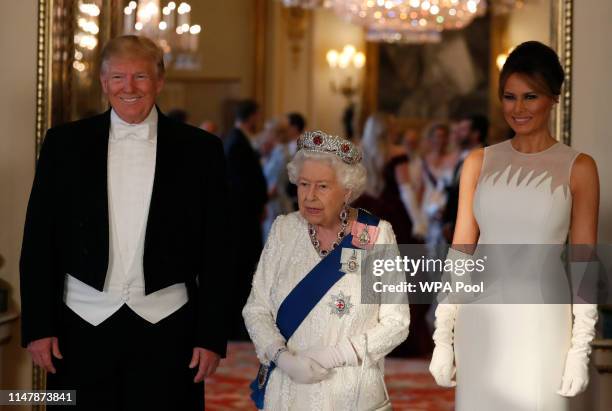 Queen Elizabeth II ,U.S. President Donald Trump and First Lady Melania Trump attend a State Banquet at Buckingham Palace on June 3, 2019 in London,...