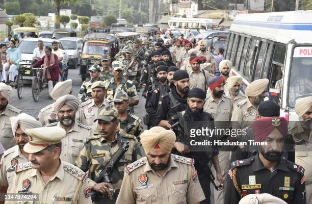 Personnel and Punjab Police commandos seen during a flag march ahead of 35th anniversary of Operation Blue Star on June 3, 2019 in Amritsar, India....
