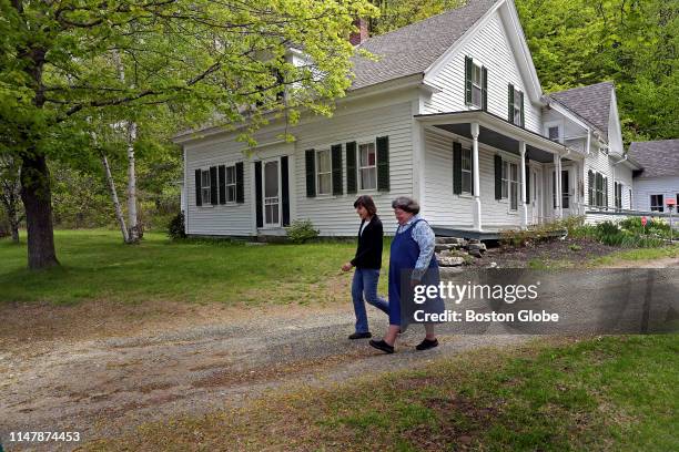 Lynne Monroe and Mary Lyn Ray walk the grounds of the home of late U.S. Poet laureate Donald Hall in Wilmot, NH on May 23, 2019. From 1975 until his...