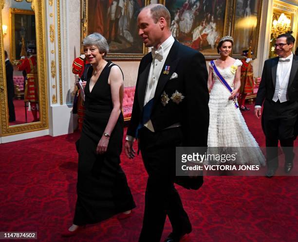 Britain's Prime Minister Theresa May walks with Britain's Prince William, Duke of Cambridge followed by Britain's Catherine, Duchess of Cambridge and...