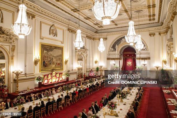 Britain's Queen Elizabeth II hosts US President Donald Trump and the US First Lady for a State Banquet in the ballroom at Buckingham Palace in...