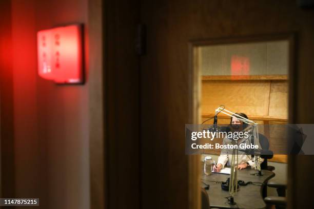 Heather Goldstone, the host of Living Lab Radio at WCAI, laughs while on the air at the WCAI station in the Woods Hole village of Falmouth, MA on May...