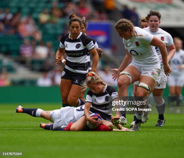 Elinor Snowsill tackled in action during the England v Barbarians Women at Twickenham, London. England women won 40-14.