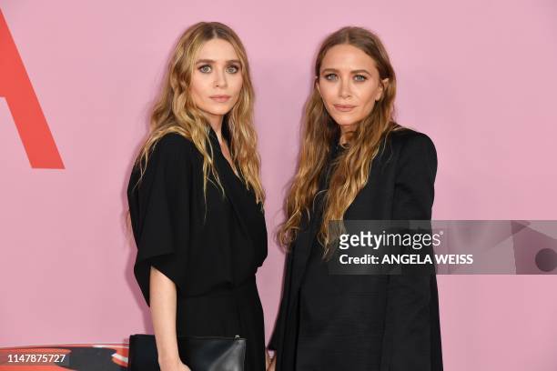 Fashion designers Mary-Kate and Ashley Olsen arrive for the 2019 CFDA fashion awards at the Brooklyn Museum in New York City on June 3, 2019.