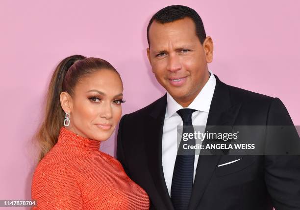 Fashion Icon Award recipient US singer Jennifer Lopez and fiance former baseball pro Alex Rodriguez arrive for the 2019 CFDA fashion awards at the...