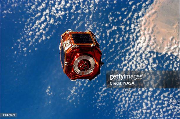 Before beginning their presleep period on their next to last day in space, the STS-88 astronauts deployed a small 590-pound satellite called SAC-A...