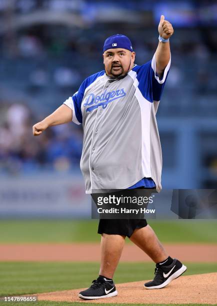 Comedian Fluffy reacts after throwing out a ceremonial first pitch before the game between the Atlanta Braves and the Los Angeles Dodgers at Dodger...